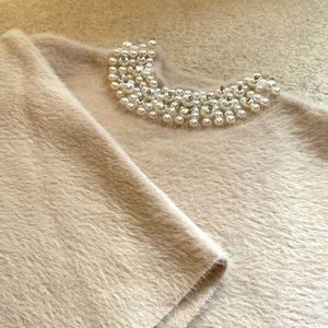 Bejeweled dolman sleeve sweater.